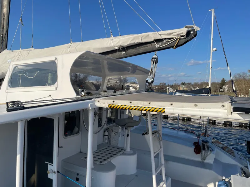 Slide: The Image of Sailboat Crowther Custom 46, 1991 model, docked with clear skies. - 19