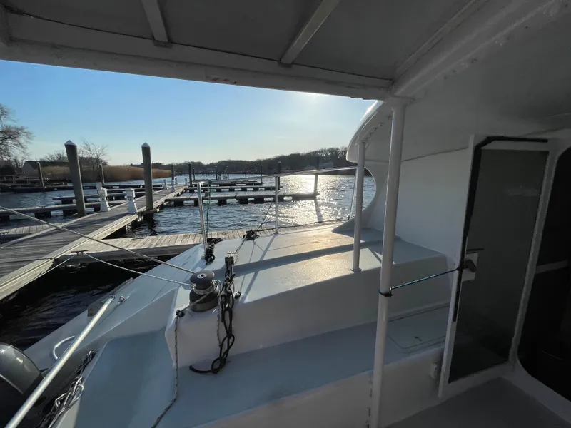 Slide: The Image of Crowther Custom 46 yacht docked at marina, 1991 model, sunny day, calm waters. - 21