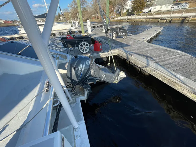 Slide: The Image of Crowther Custom 46 sailboat docked, featuring Yamaha outboard motor, 1991 model. - 24