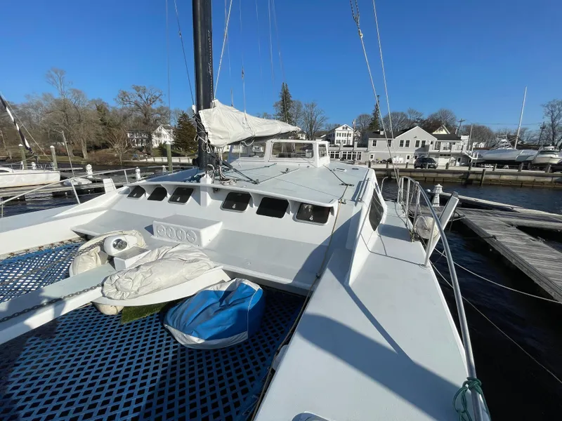 Slide: The Image of Sailboat Crowther Custom 46, 1991 model, docked at marina with clear blue sky. - 3