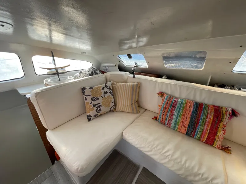 Slide: The Image of Interior of 1991 Crowther Custom 46 yacht with cozy seating and colorful pillows. - 30
