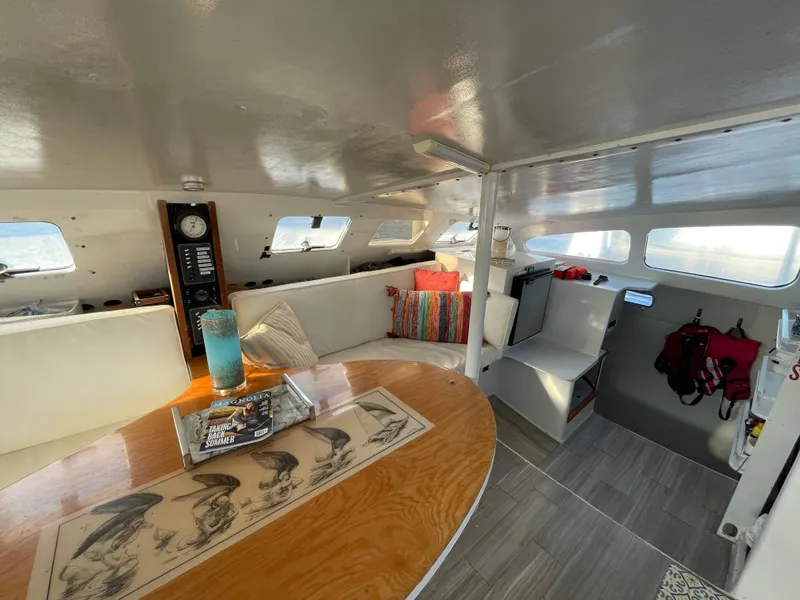 Slide: The Image of Interior of 1991 Crowther Custom 46 yacht with cozy seating and nautical decor. - 31