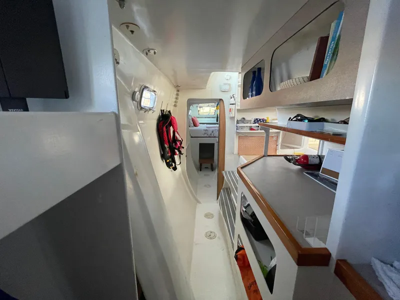 Slide: The Image of Interior of 1991 Crowther Custom 46 yacht, featuring sleek design and organized storage. - 40