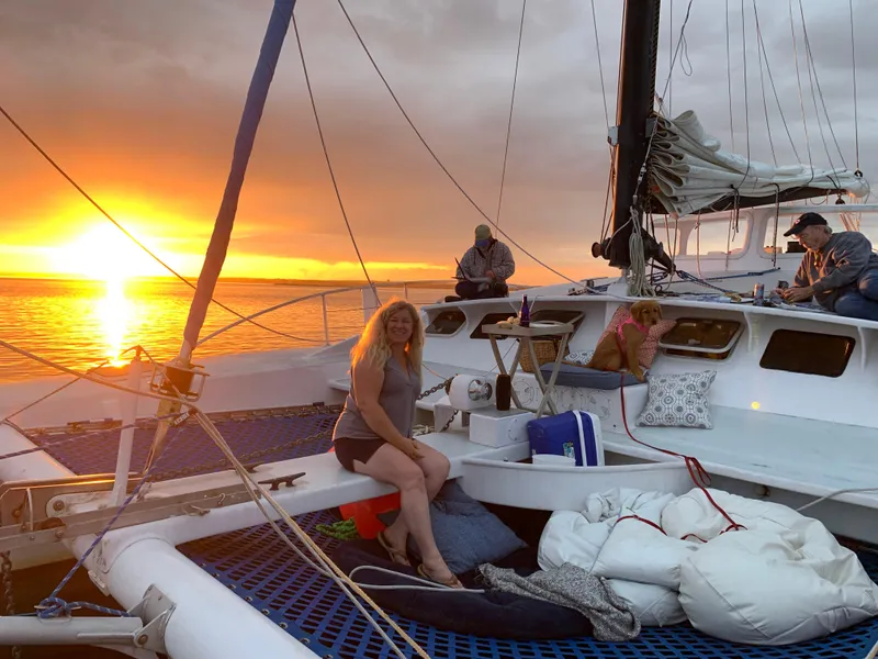 Slide: The Image of People relaxing on a 1991 Crowther Custom 46 catamaran at sunset. - 50