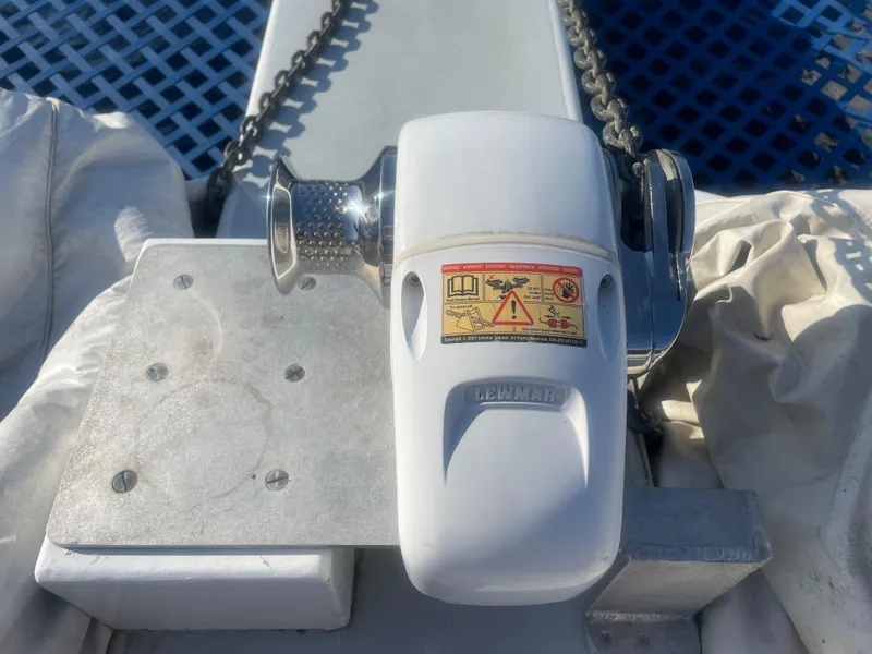 Slide: The Image of Windlass on 1991 Crowther Custom 46 sailboat deck with chain and warning label. - 9