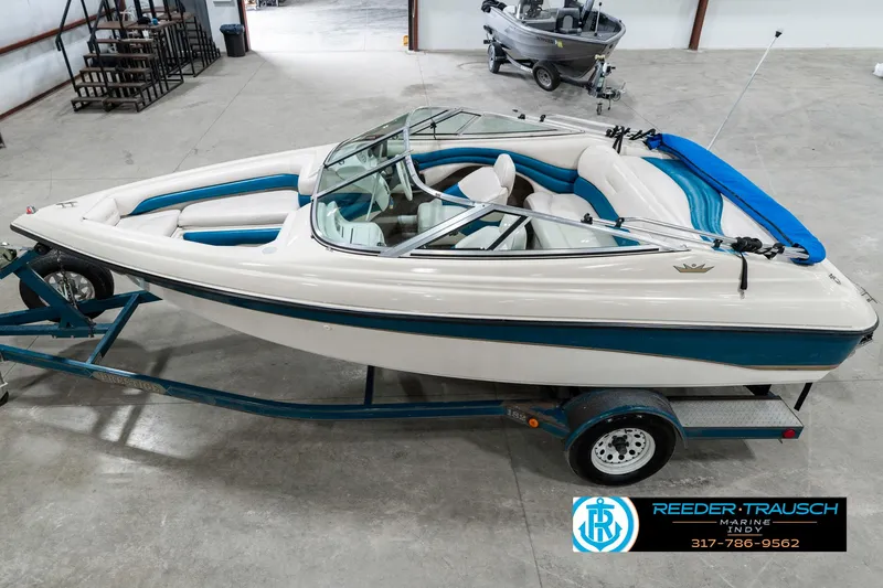 Slide: The Image of 1995 Crownline 182 BR boat on trailer in indoor storage facility. - 1