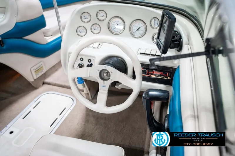 Slide: The Image of 1995 Crownline 182 BR boat dashboard with steering wheel and gauges. - 29