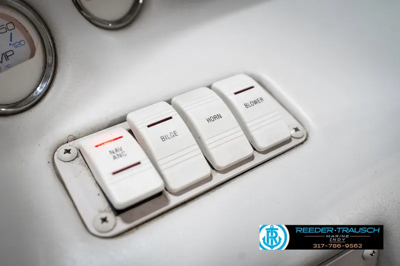 Slide: The Image of Dashboard switches on a 1995 Crownline 182 BR boat, including bilge and horn controls. - 33