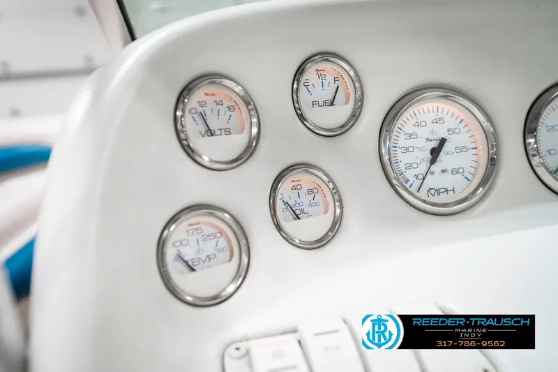 Slide: The Image of Dashboard of a 1995 Crownline 182 BR boat with various gauges and controls. - 34