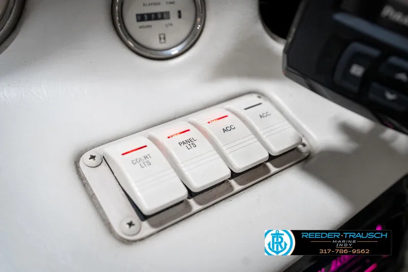 Slide: The Image of Dashboard switches of a 1995 Crownline 182 BR boat. - 38