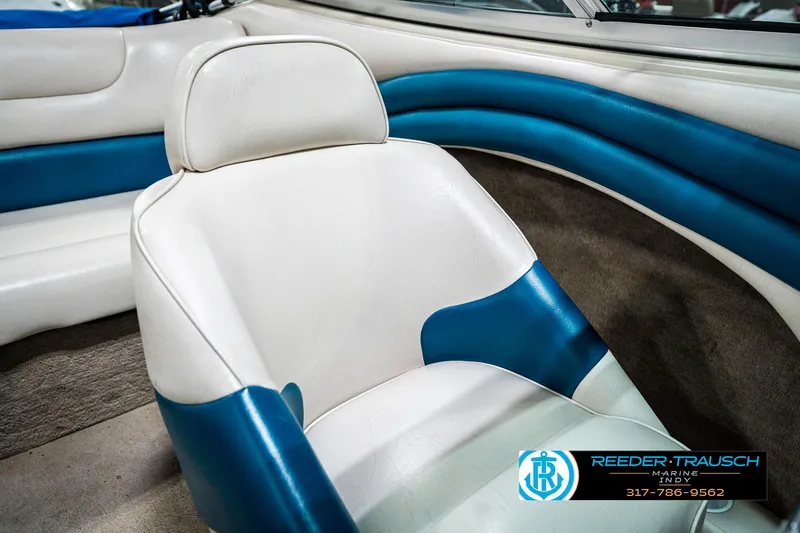 Slide: The Image of 1995 Crownline 182 BR boat interior with white and blue seating. - 41