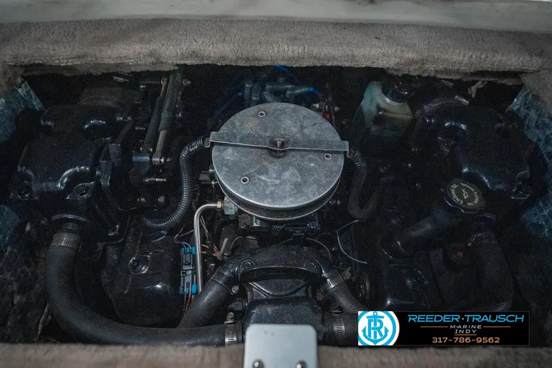 Slide: The Image of Engine compartment of a 1995 Crownline 182 BR boat, featuring mechanical components. - 45