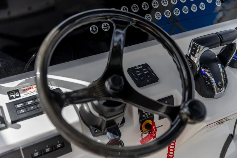 Slide: The Image of Steering wheel and controls of 2023 Edgewater 370CC boat cockpit. - 11