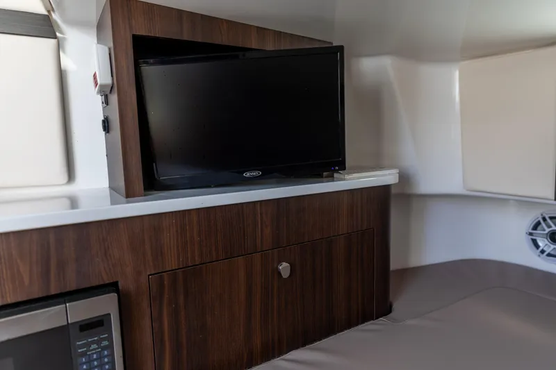 Slide: The Image of Interior of 2023 Edgewater 370CC boat with TV and microwave. - 14