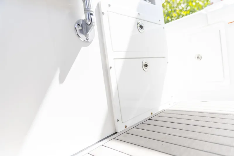 Slide: The Image of Edgewater 370CC 2023 boat interior with storage compartments and sleek flooring. - 19