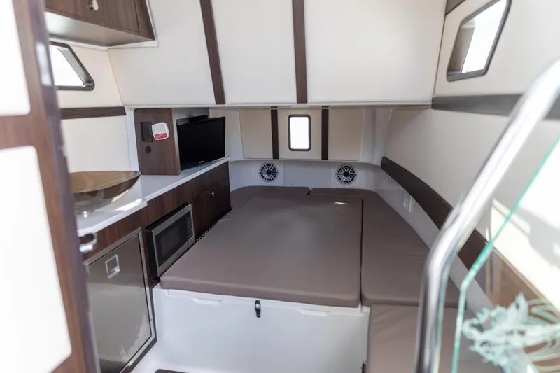 Slide: The Image of Luxurious interior of 2023 Edgewater 370CC boat with modern amenities and comfortable seating. - 2