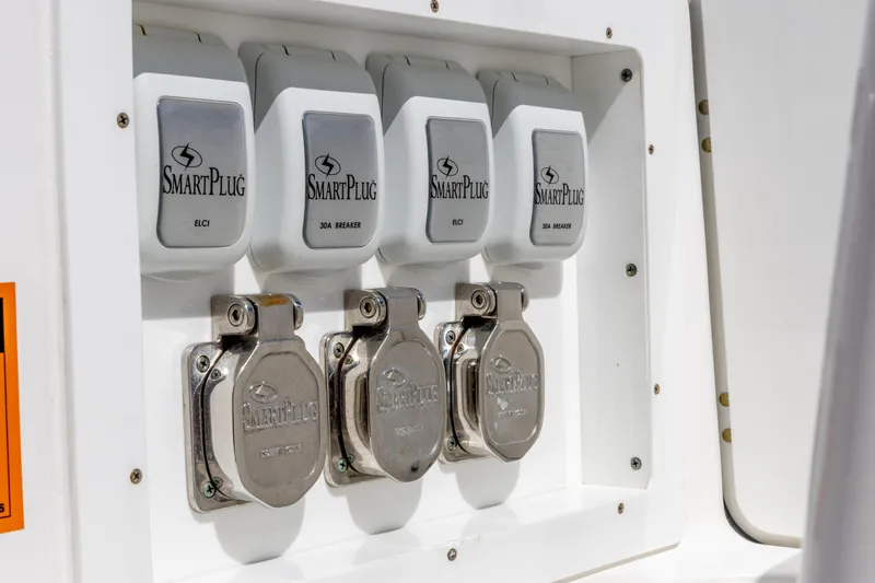 Slide: The Image of Edgewater 370CC 2023 SmartPlug electrical panel with multiple outlets. - 24