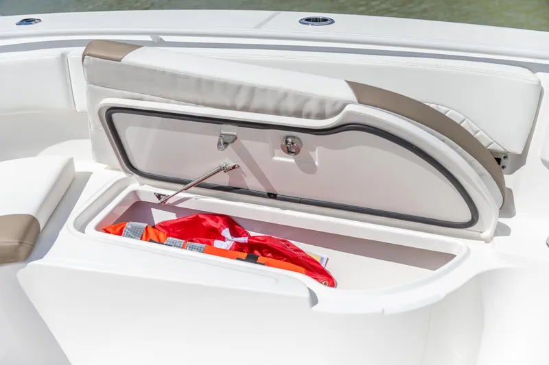 Slide: The Image of 2023 Edgewater 370CC boat storage compartment with life jacket inside. - 29