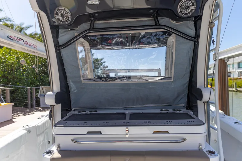 Slide: The Image of 2023 Edgewater 370CC boat interior with seating and storage area. - 8