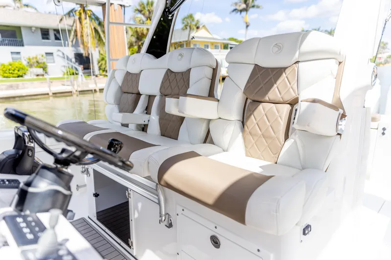 Slide: The Image of 2023 Edgewater 370CC boat interior with luxurious seating and modern design. - 9