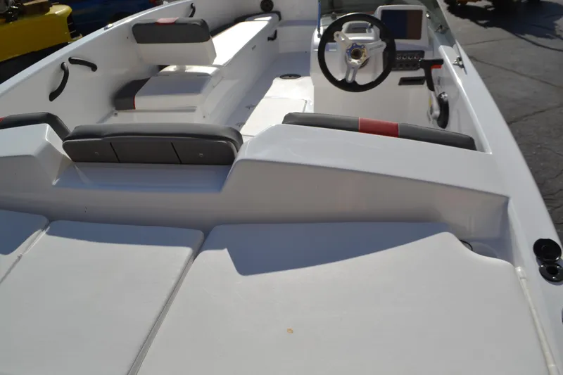 Slide: The Image of 2025 Tahoe T18 boat interior with steering wheel and seating. - 2