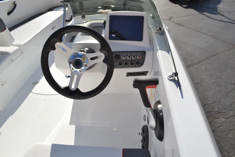 Slide: The Image of 2025 Tahoe T18 boat cockpit with steering wheel and control panel. - 3