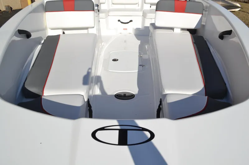 Slide: The Image of 2025 Tahoe T18 boat interior with white and gray seating, red accents, and logo. - 4