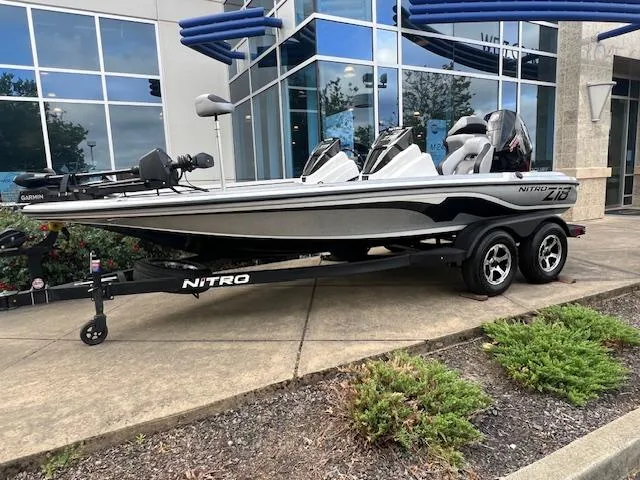 The Image of 2025 Nitro Z18 Pro boat on trailer, parked outside modern building. - 0