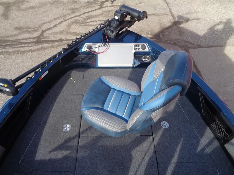 Slide: The Image of 2024 Ranger 1880MS boat interior with blue seat and control panel. - 10
