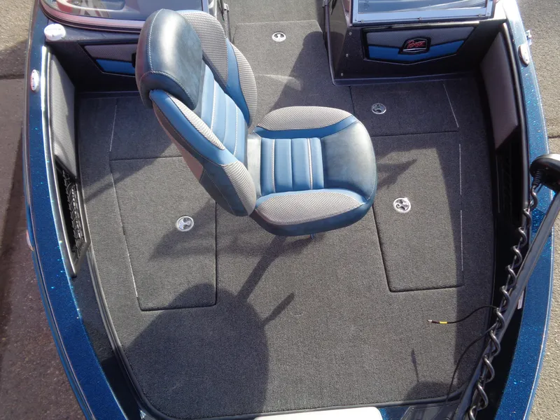 Slide: The Image of 2024 Ranger 1880MS boat interior with blue seat and carpeted deck. - 11