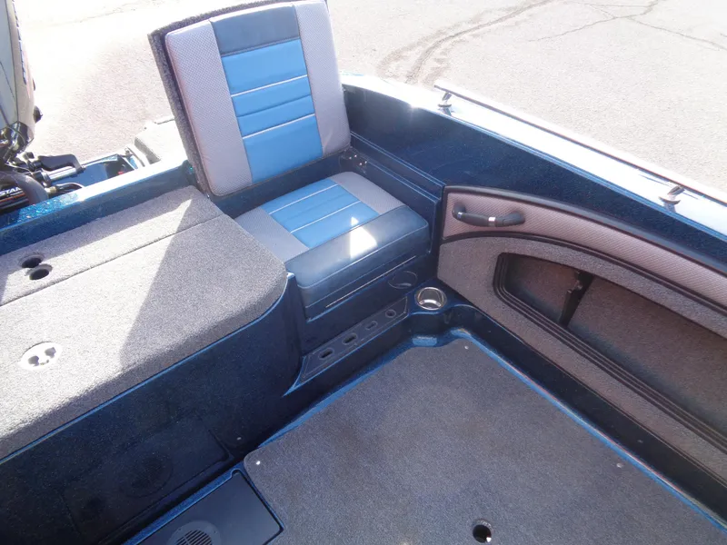 Slide: The Image of 2024 Ranger 1880MS boat interior with blue and gray seating and storage compartments. - 12