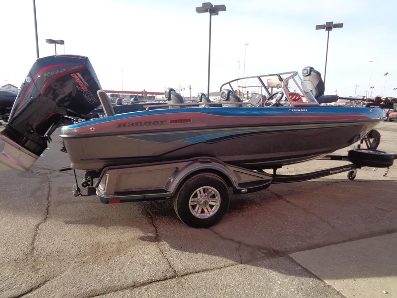 Slide: The Image of 2024 Ranger 1880MS boat on trailer, featuring sleek design and powerful outboard motor. - 3