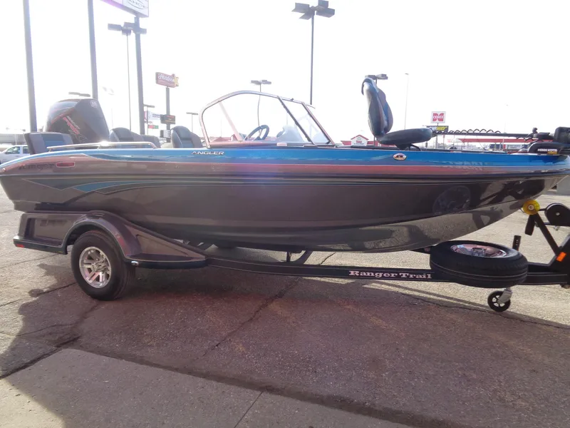 Slide: The Image of 2024 Ranger 1880MS boat on trailer, side view in outdoor setting. - 5
