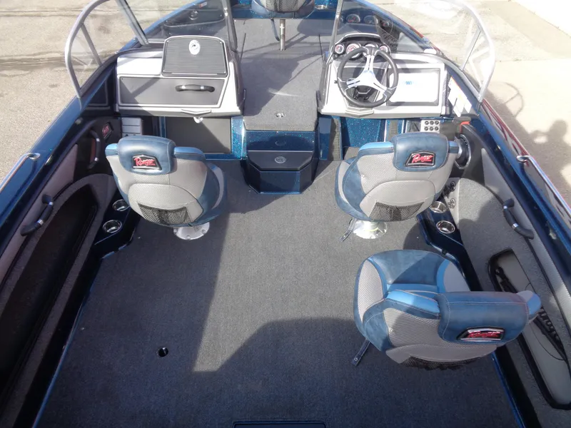 Slide: The Image of 2024 Ranger 1880MS boat interior with seating and steering console. - 6