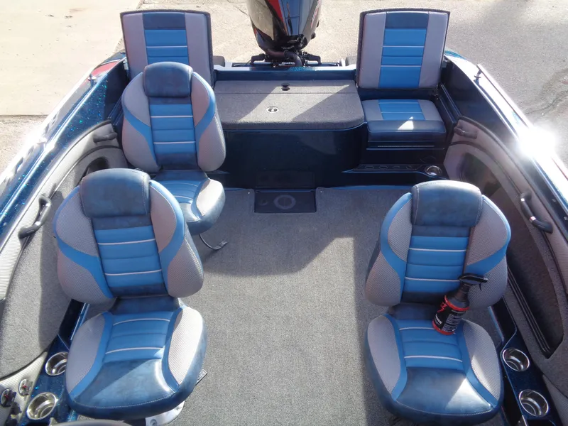 Slide: The Image of 2024 Ranger 1880MS boat interior with blue and gray seating arrangement. - 7