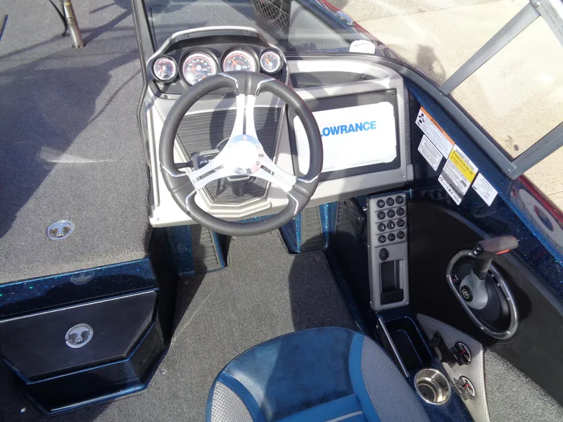 Slide: The Image of 2024 Ranger 1880MS boat dashboard with steering wheel and Lowrance display. - 8