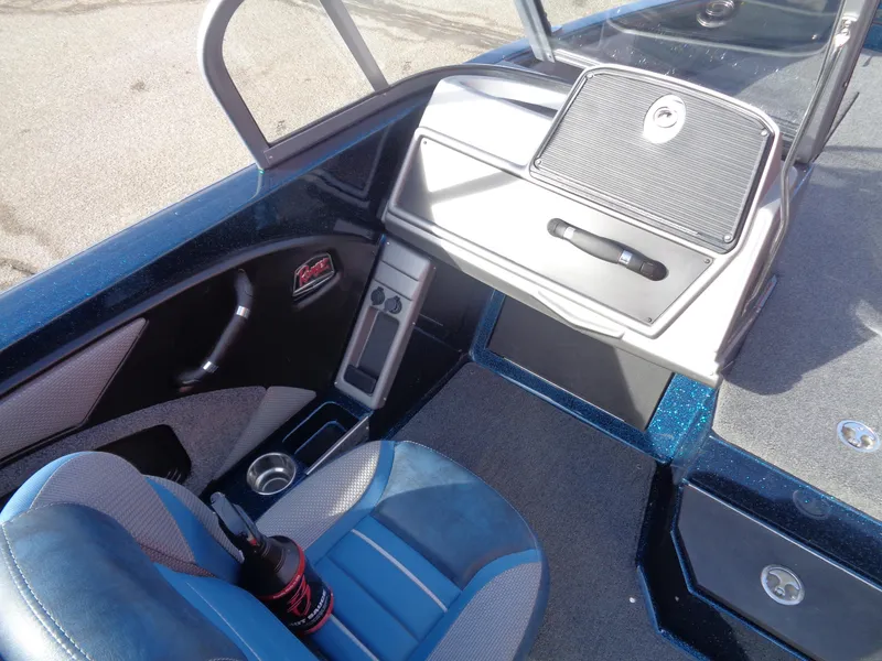 Slide: The Image of 2024 Ranger 1880MS boat interior with blue seating and dashboard controls. - 9