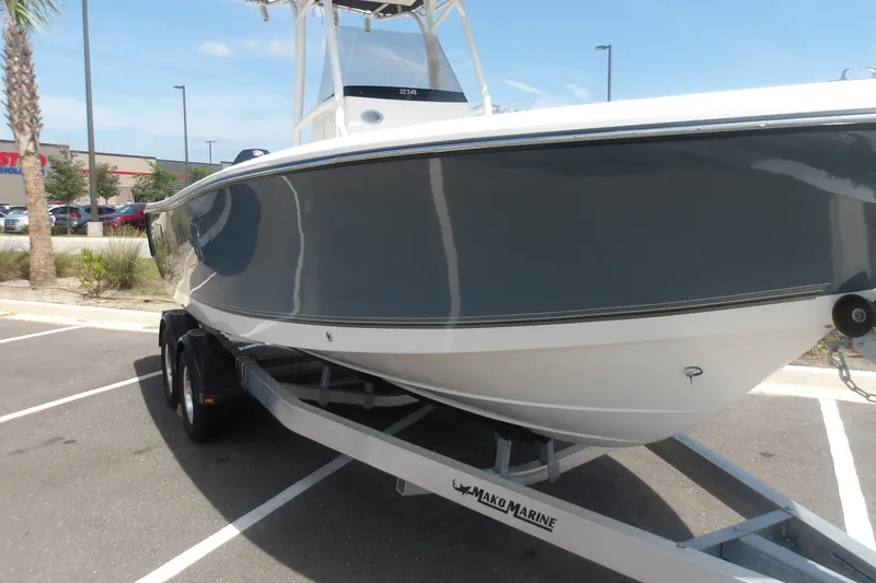 Slide: The Image of 2025 Mako 214 Center Console boat on trailer in parking lot. - 3