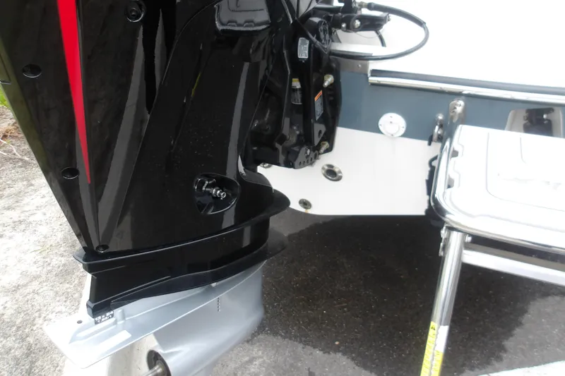 Slide: The Image of 2025 Mako 214 Center Console boat engine and ladder detail. - 11