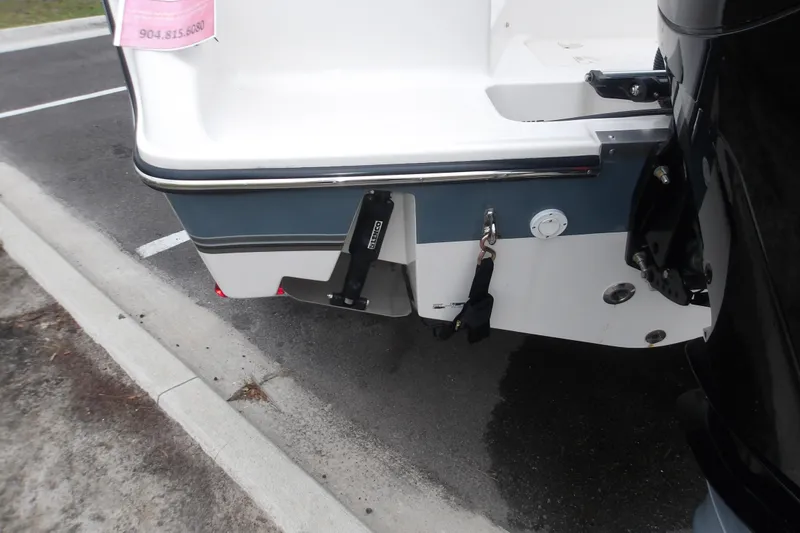 Slide: The Image of 2025 Mako 214 Center Console boat stern with motor mount and hardware. - 12