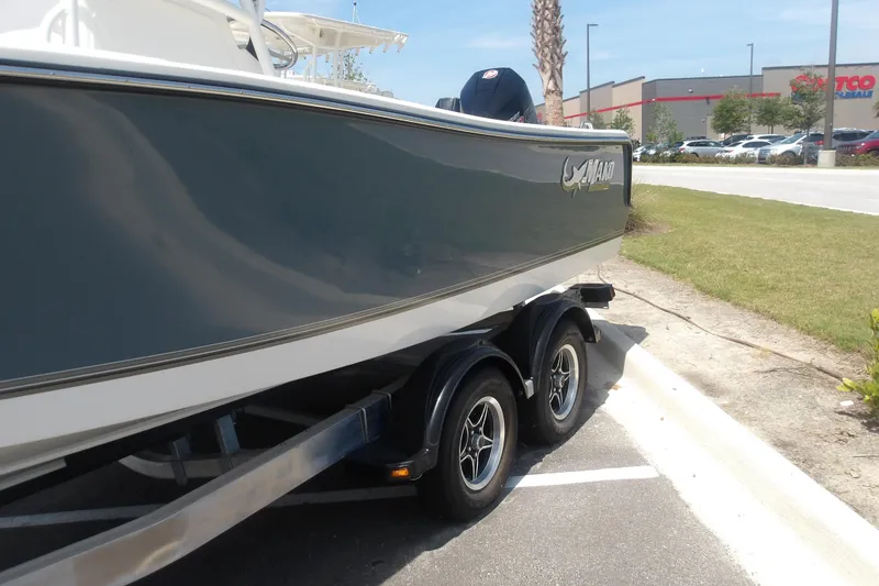 Slide: The Image of 2025 Mako 214 Center Console boat on trailer in parking lot. - 5