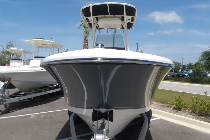 Slide: The Image of 2025 Mako 214 Center Console boat on trailer, parked outdoors. - 4