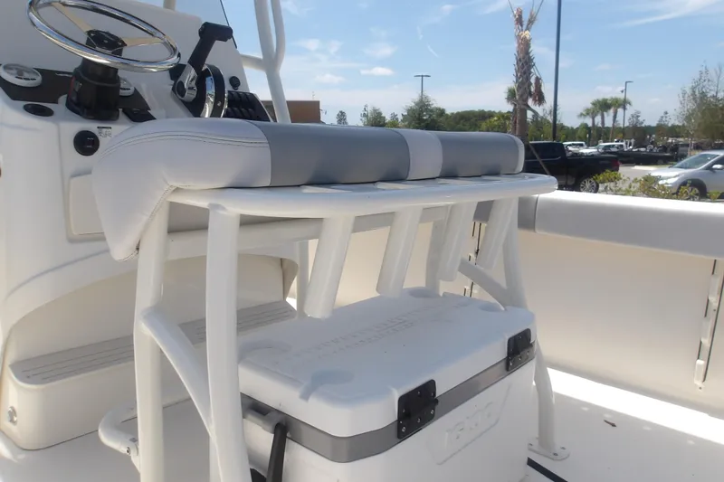Slide: The Image of 2025 Mako 214 Center Console boat interior with steering wheel and seating. - 20