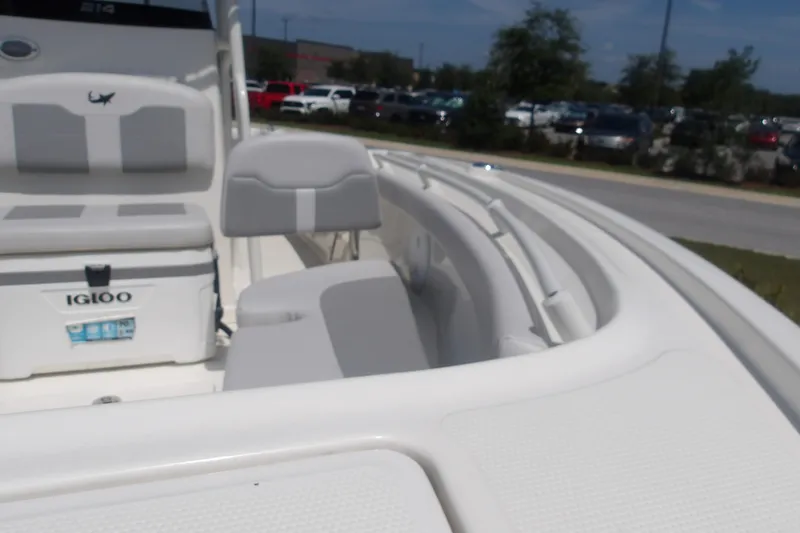 Slide: The Image of 2025 Mako 214 Center Console boat interior with seating and Igloo cooler. - 15