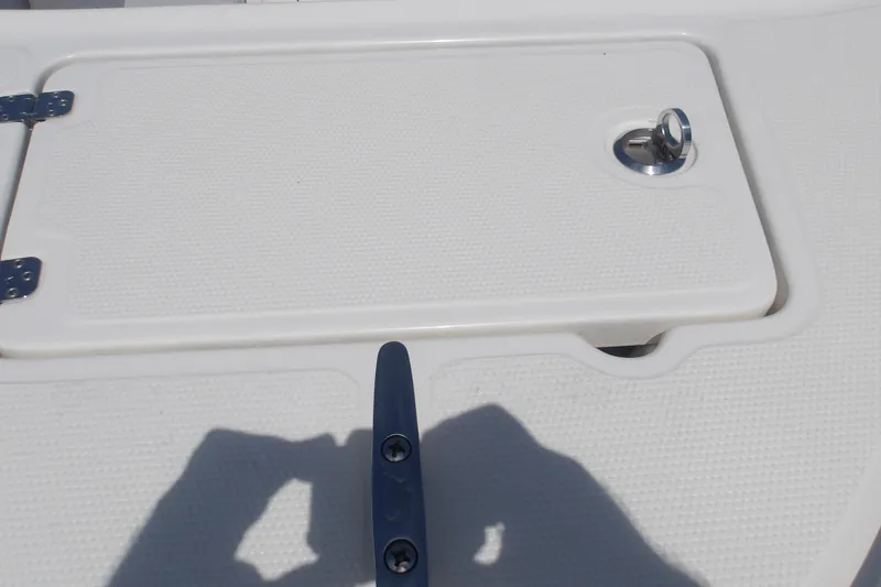Slide: The Image of 2025 Mako 214 Center Console boat deck with hatch and cleat. - 16