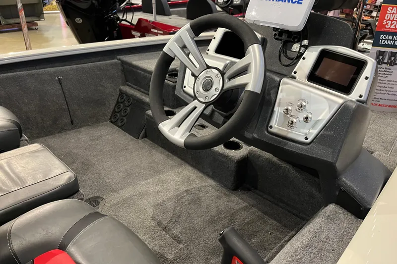 Slide: The Image of 2025 Tracker Pro Team 195 Tournament Edition boat interior with steering wheel and control panel. - 3