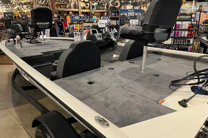 Slide: The Image of 2025 Tracker Pro Team 195 Tournament Edition boat displayed in a showroom setting. - 7