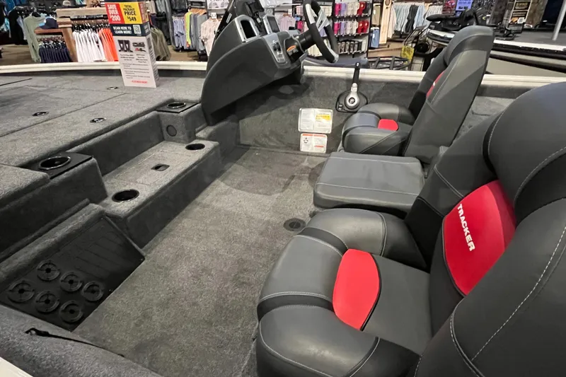 Slide: The Image of 2025 Tracker Pro Team 195 Tournament Edition boat interior with seating and steering console. - 9