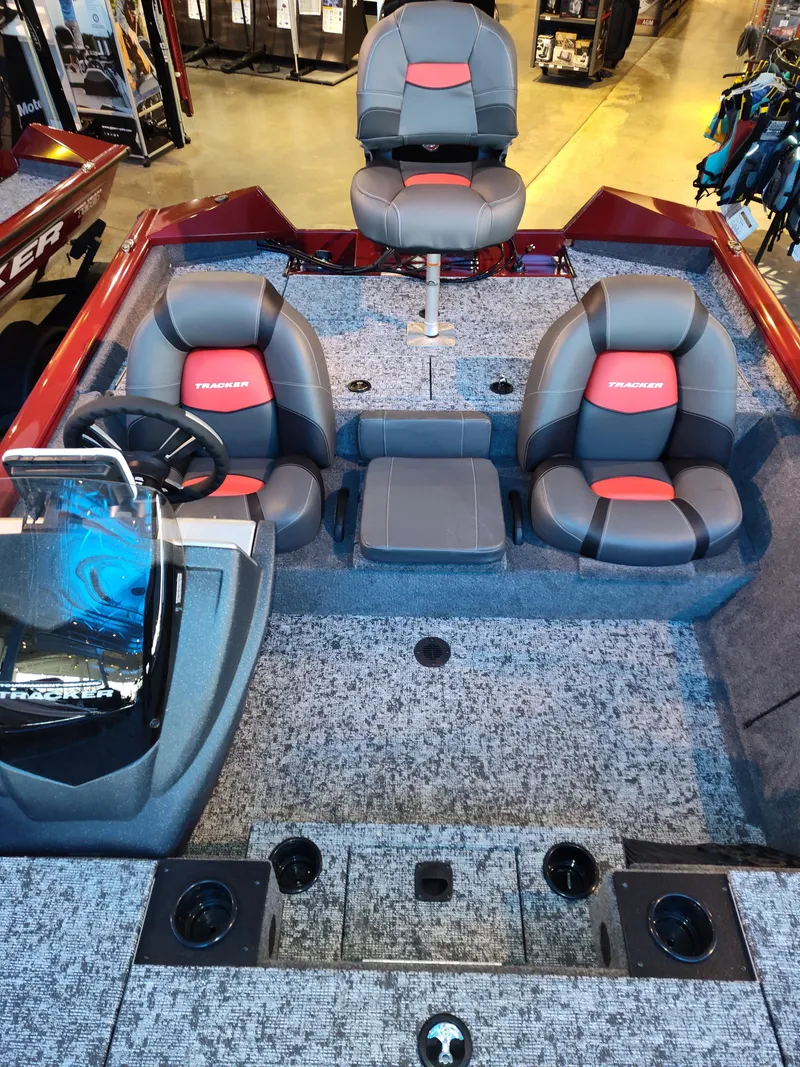 Slide: The Image of 2025 Tracker Pro Team 195 Tournament Edition boat interior with seating and control console. - 4