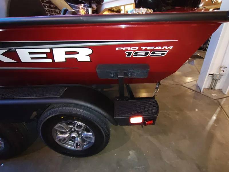 Slide: The Image of 2025 Tracker Pro Team 195 Tournament Edition boat on trailer, showcasing rear design and branding. - 6